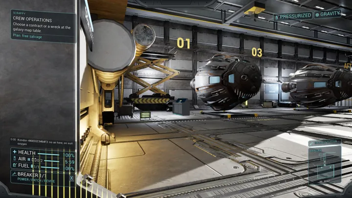 A brightly lit industrial hangar contains player ships, gantries and numbered berths.